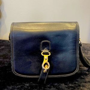 Vintage GUCCI handbag. Great condition, black with gold accents.